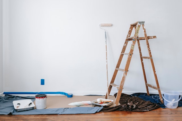 ladder and paint supplies in an apartment