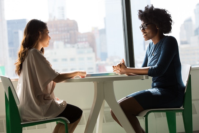 two people sitting and having open communication